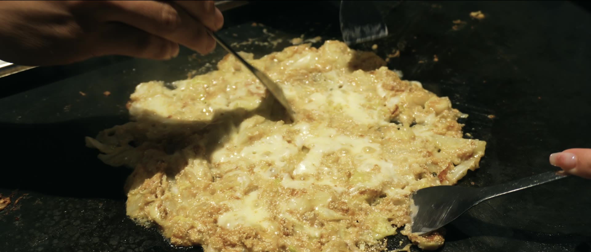 Mentaiko and cheese monjayaki cooking at Tamatoya in Tenma